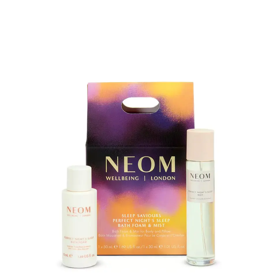 NEOM Sleep Saviours set with bath foam and mist in colourful packaging.