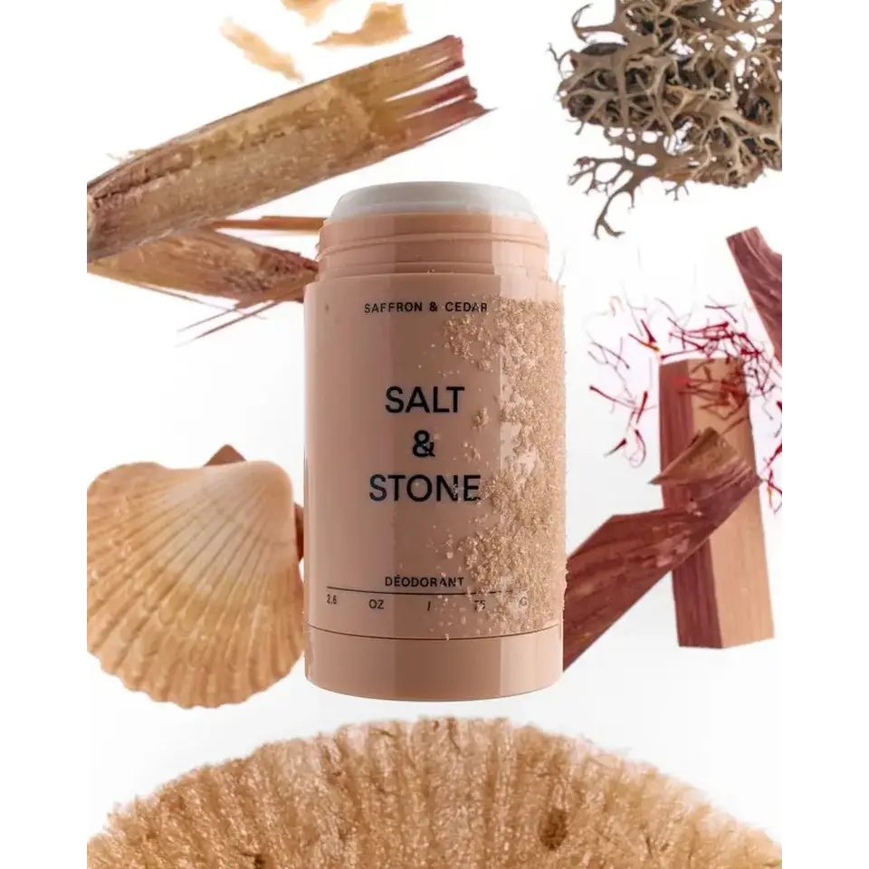 Salt & Stone deodorant with saffron, cedar, and natural elements around.