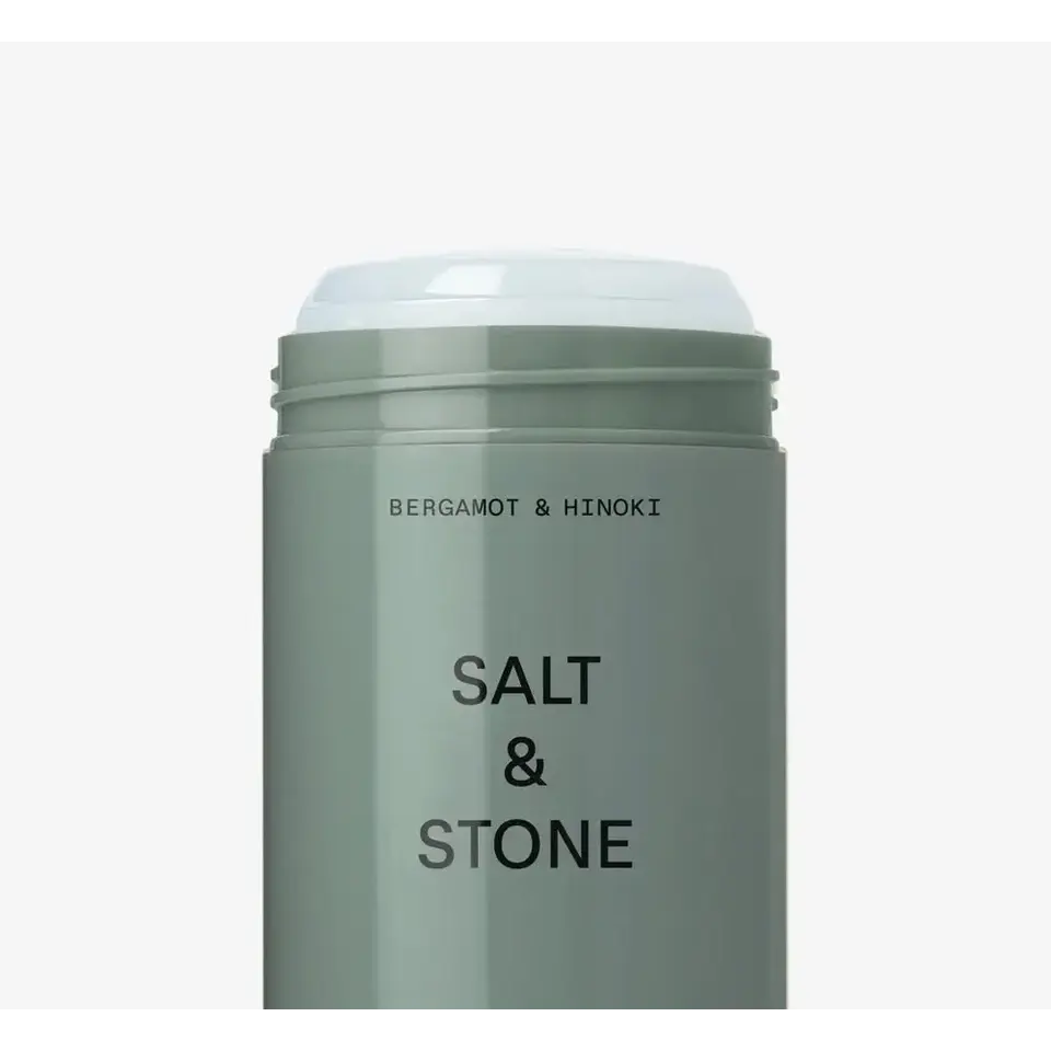 Grey deodorant stick labelled "Salt & Stone" with "Bergamot & Hinoki" text.